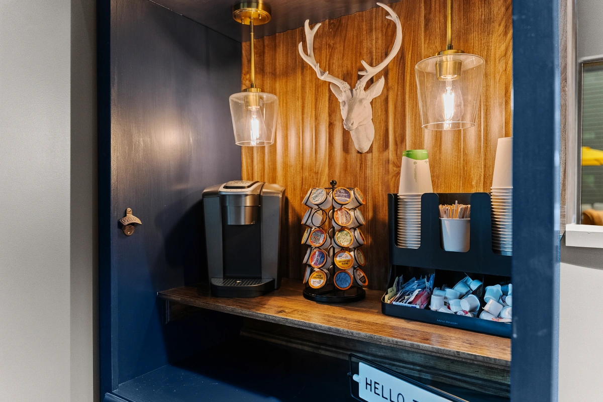 Coffee area inside dental office with beverage station for patients and staff