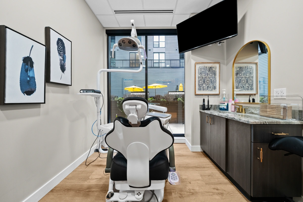 Advanced dental operatory inside Omni Dental clinic with treatment chair and equipment