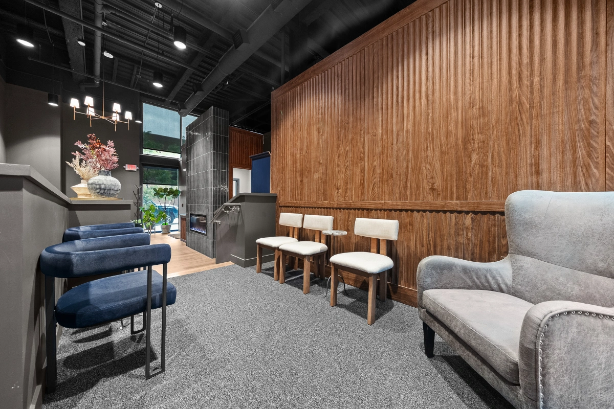 Comfortable reception seating area inside Omni Dental clinic for patients