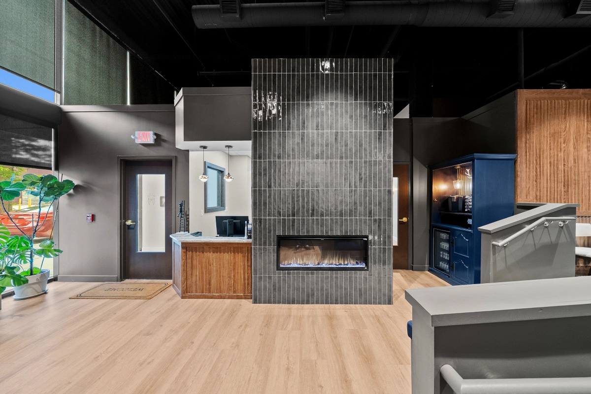 Front-facing view of dental office reception area with front desk and welcoming entrance