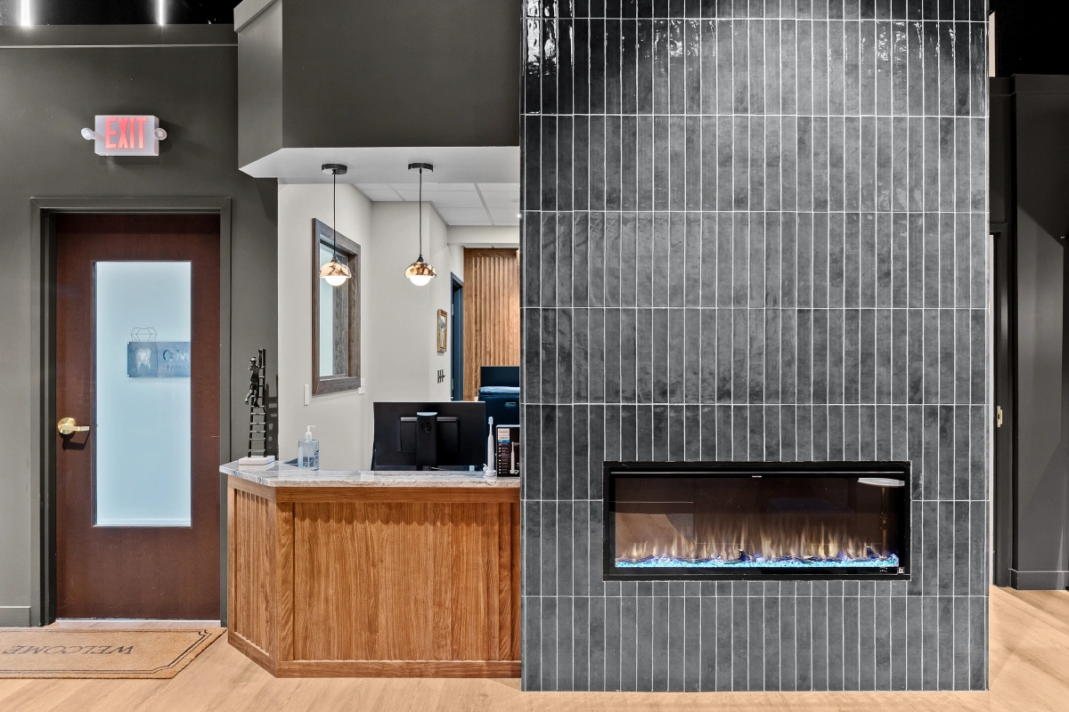 Reception area inside dental office with front desk and patient check-in space